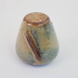 Small beige glazed ceramic vase with abstract relief pattern