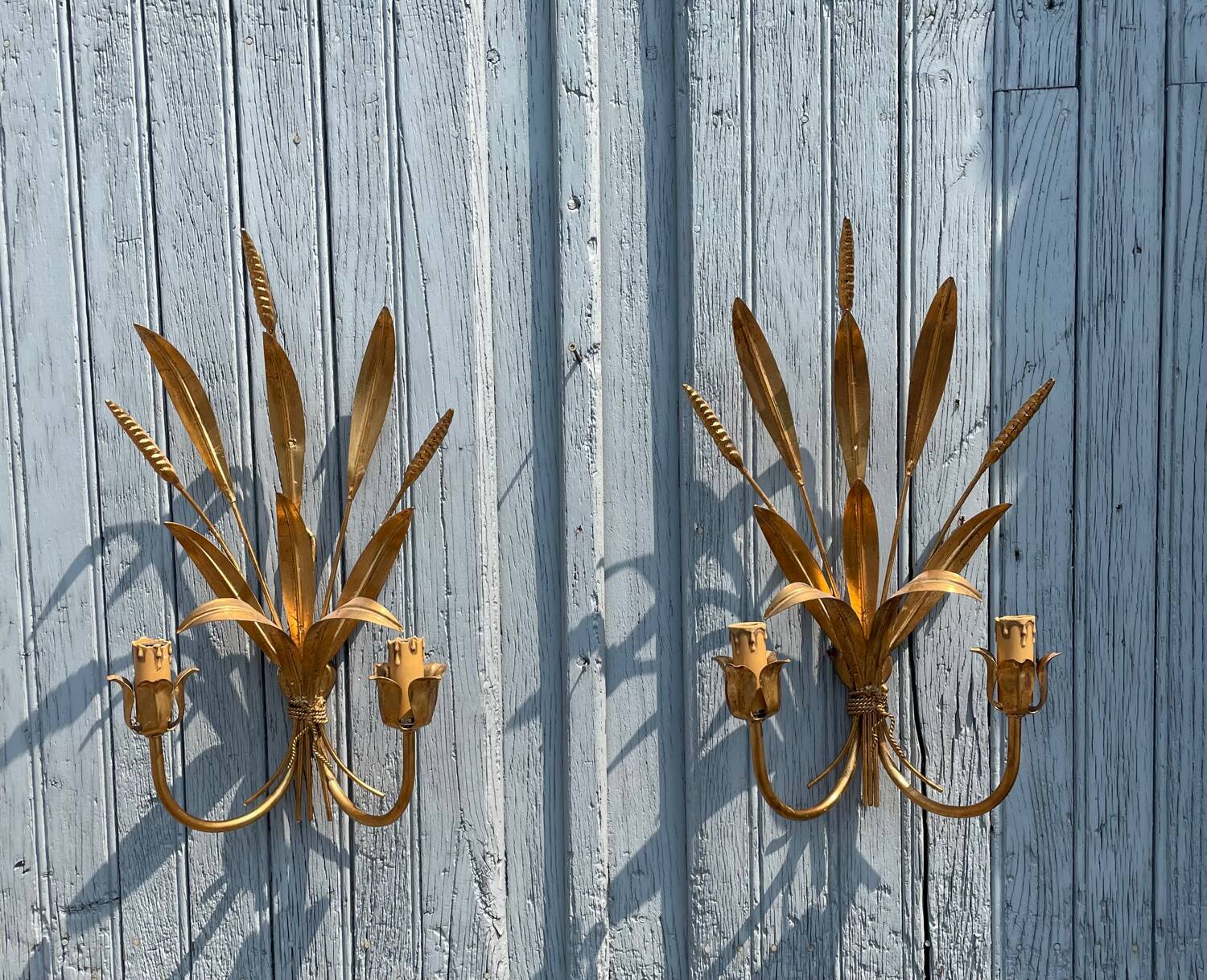 Pair of wall sconces in the shape of a wheat sheaf with two lights.