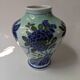 Porcelain vase, Asian art, hand-painted floral decoration.