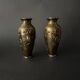 Pair of Japanese vases in chiselled bronze with inlaid bird decoration.