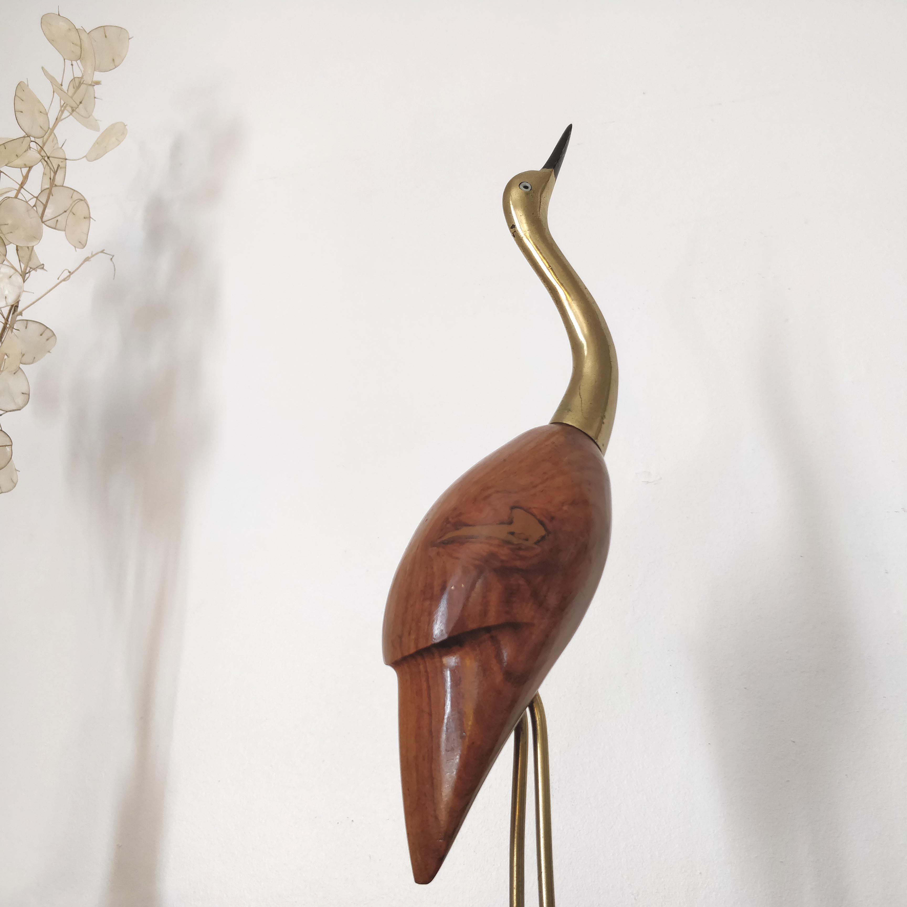 Large wooden and brass heron