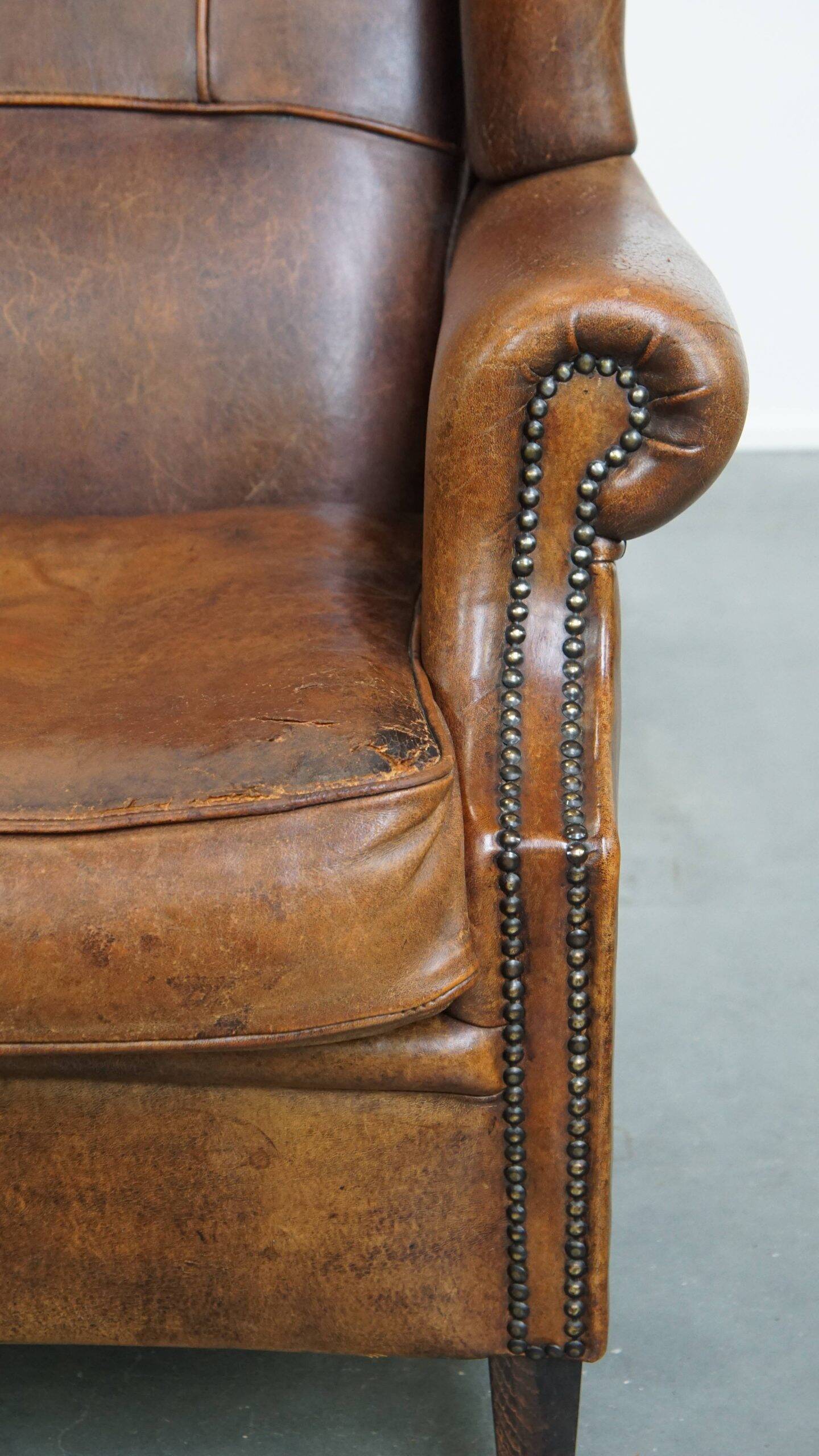 Sheepskin wingback chair in good condition