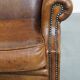Sheepskin wingback chair in good condition