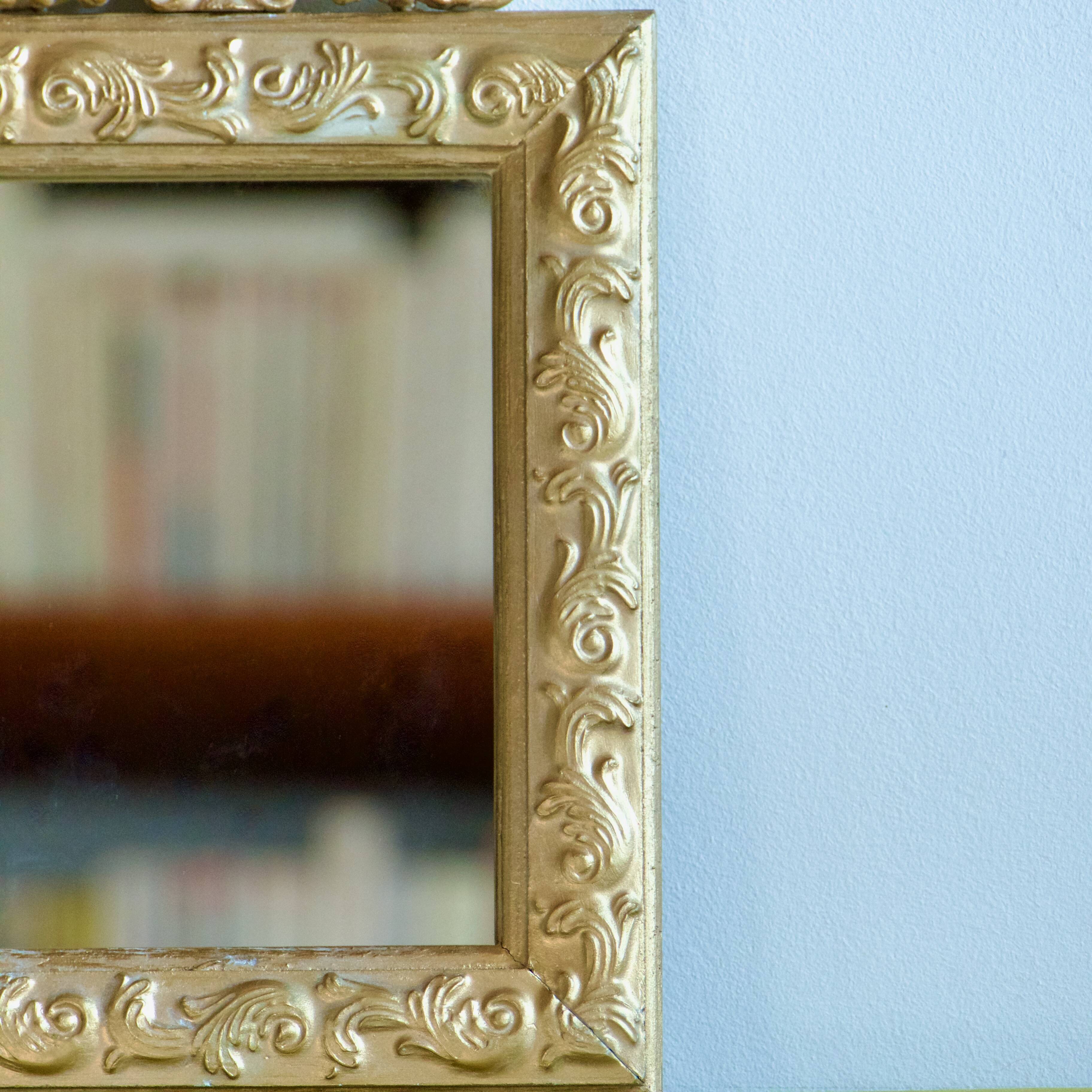 Antique gilded shell mirror with arabesque moldings