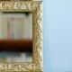 Antique gilded shell mirror with arabesque moldings