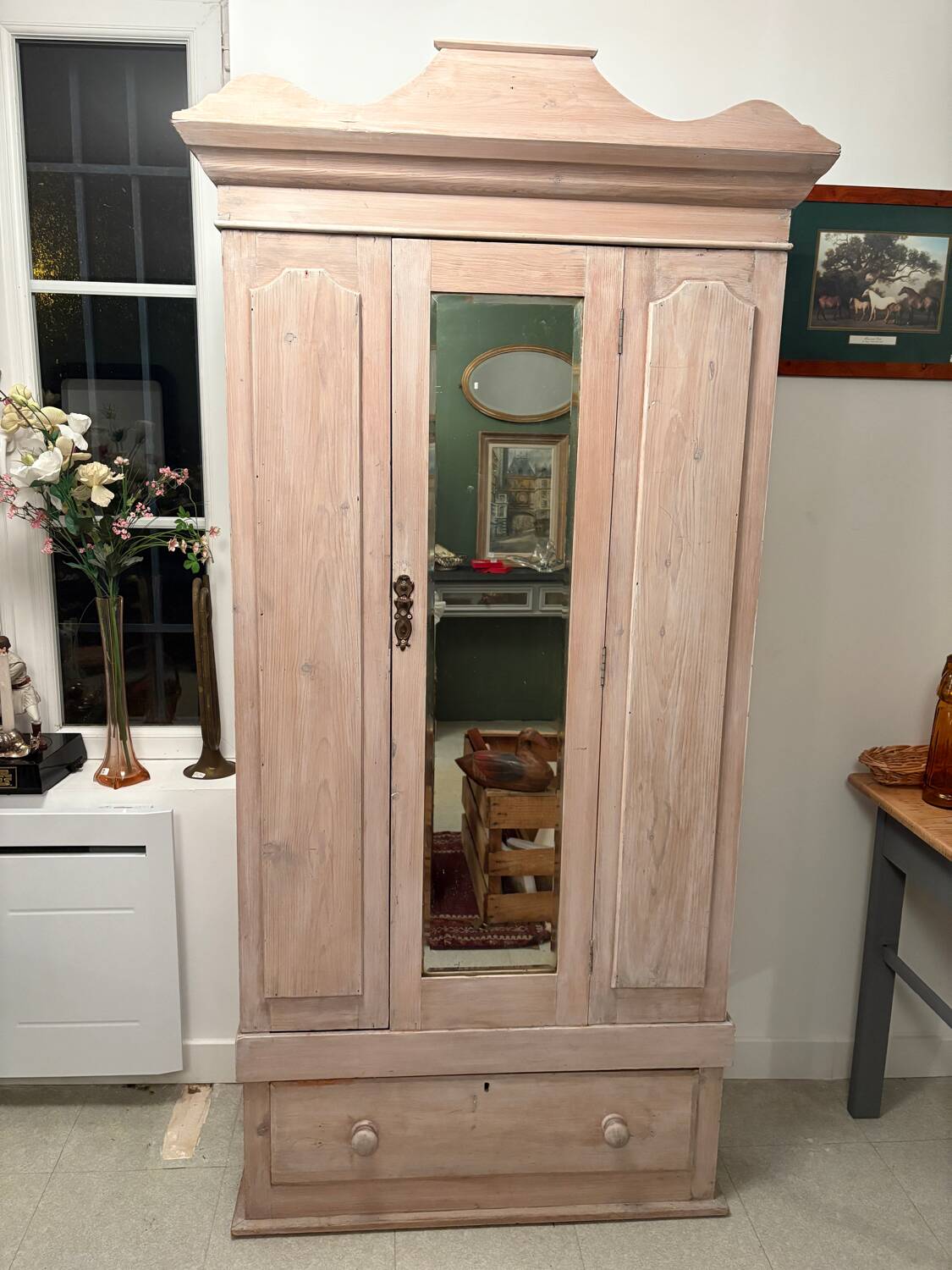 Antique English wardrobe in pale pink patina.