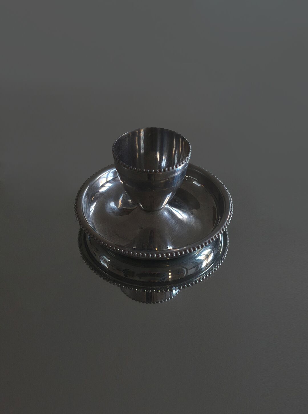 Stainless steel egg cup with saucer and beaded edge