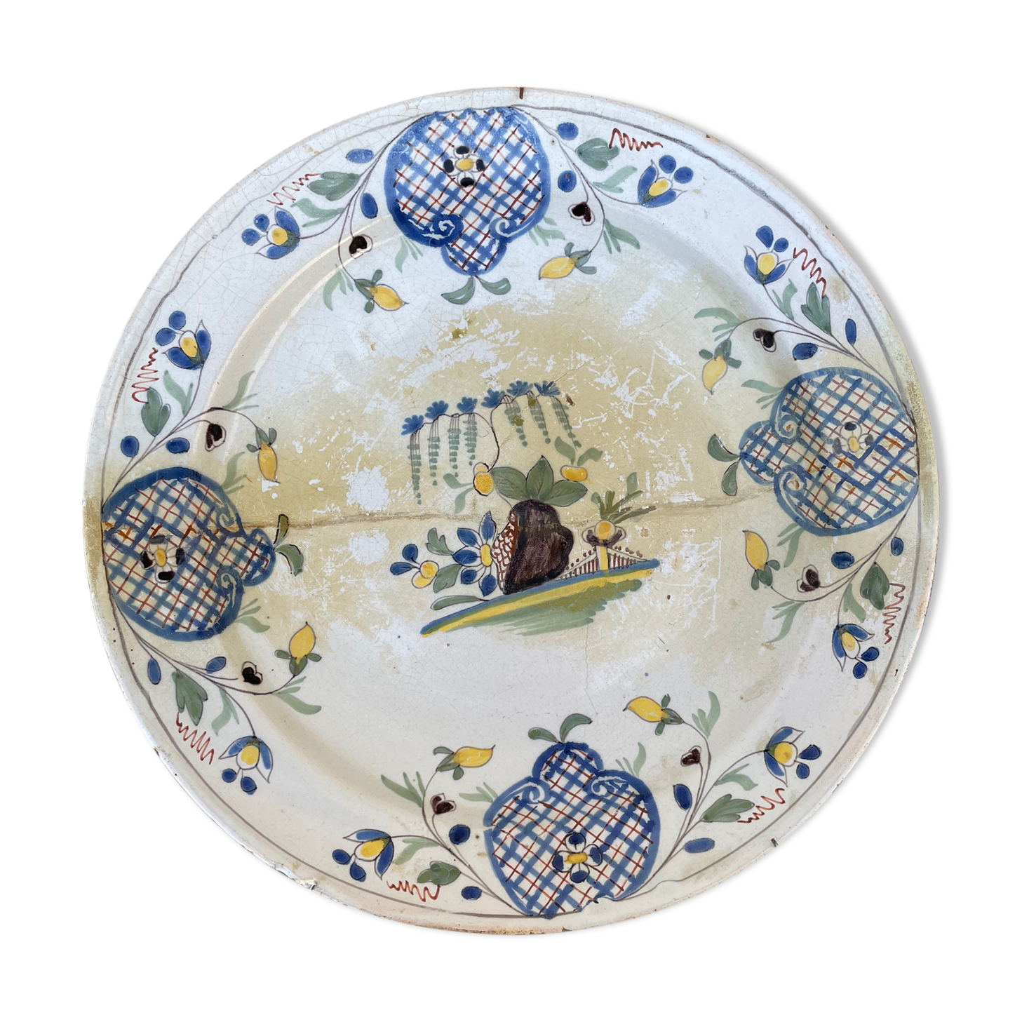 Restored antique dish with floral motif