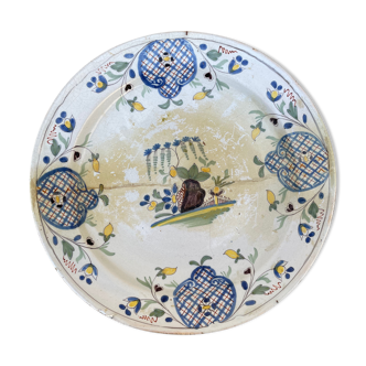 Restored antique dish with floral motif