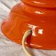 Large vintage lamp base in orange lacquered wood