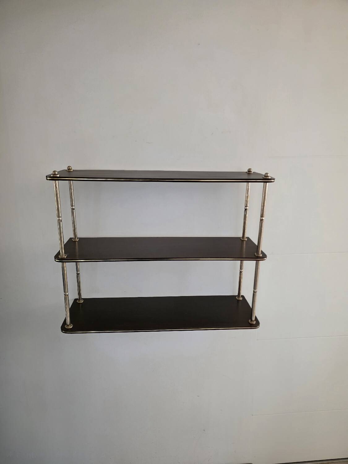 Wooden shelf with gold metal