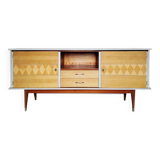 Wooden sideboard in soft green