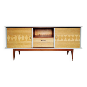 Wooden sideboard in soft green