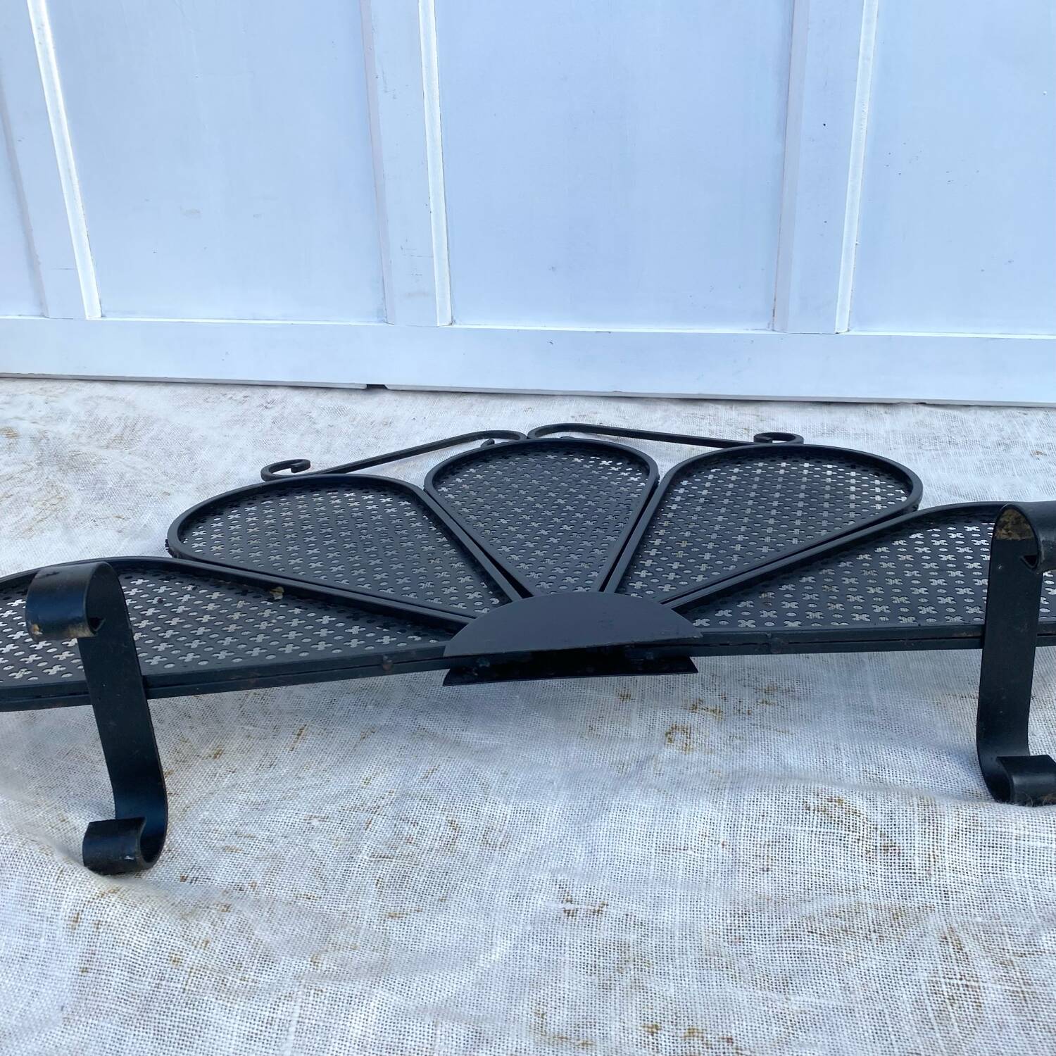 Vintage 1950s fireplace screen, fan shape.