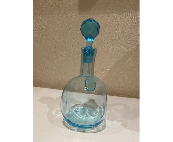 Blue carafe with vintage button