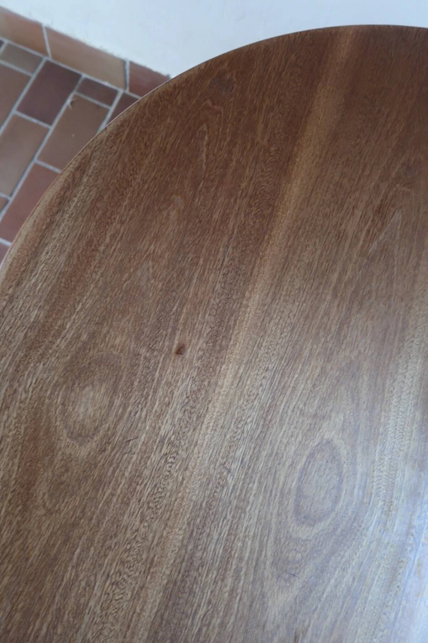 Round table with a central pedestal, light wood, 1990s.