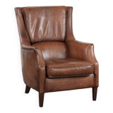 Cognac brown cow leather armchair with decorative nail finish