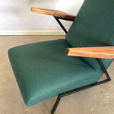 Lounge or easy chair with armrests