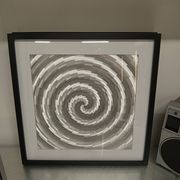 a Kinetic Op Art Aluchromy under glass frame.