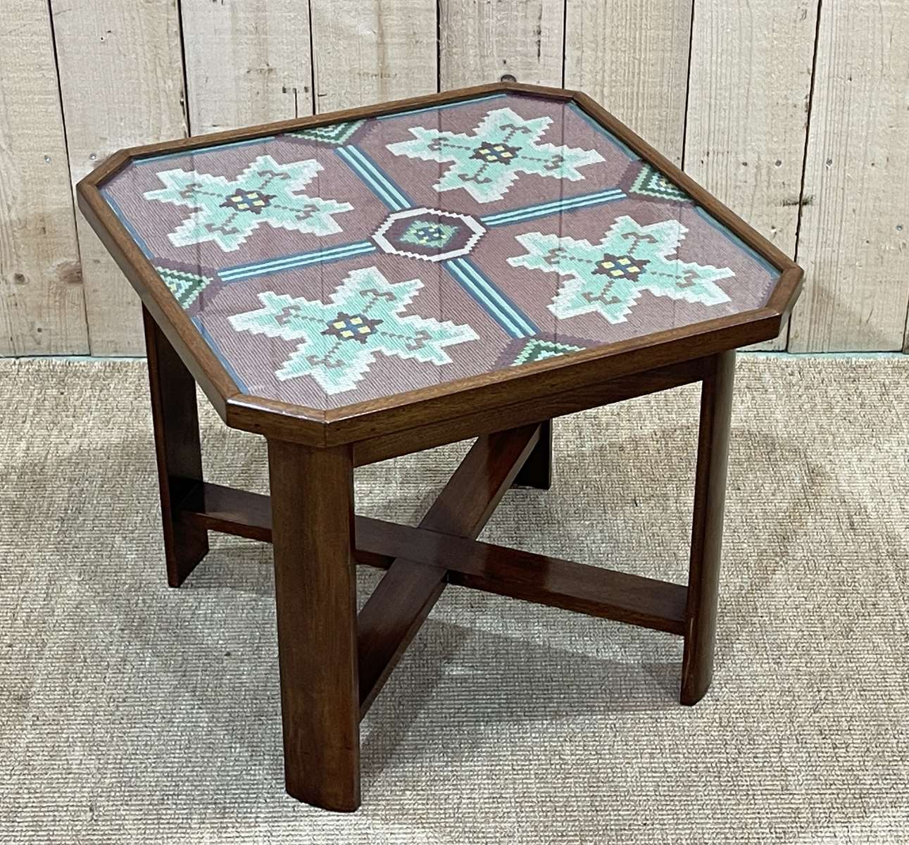 Art Deco side table in mahogany and top covered with a fabric under glass plate