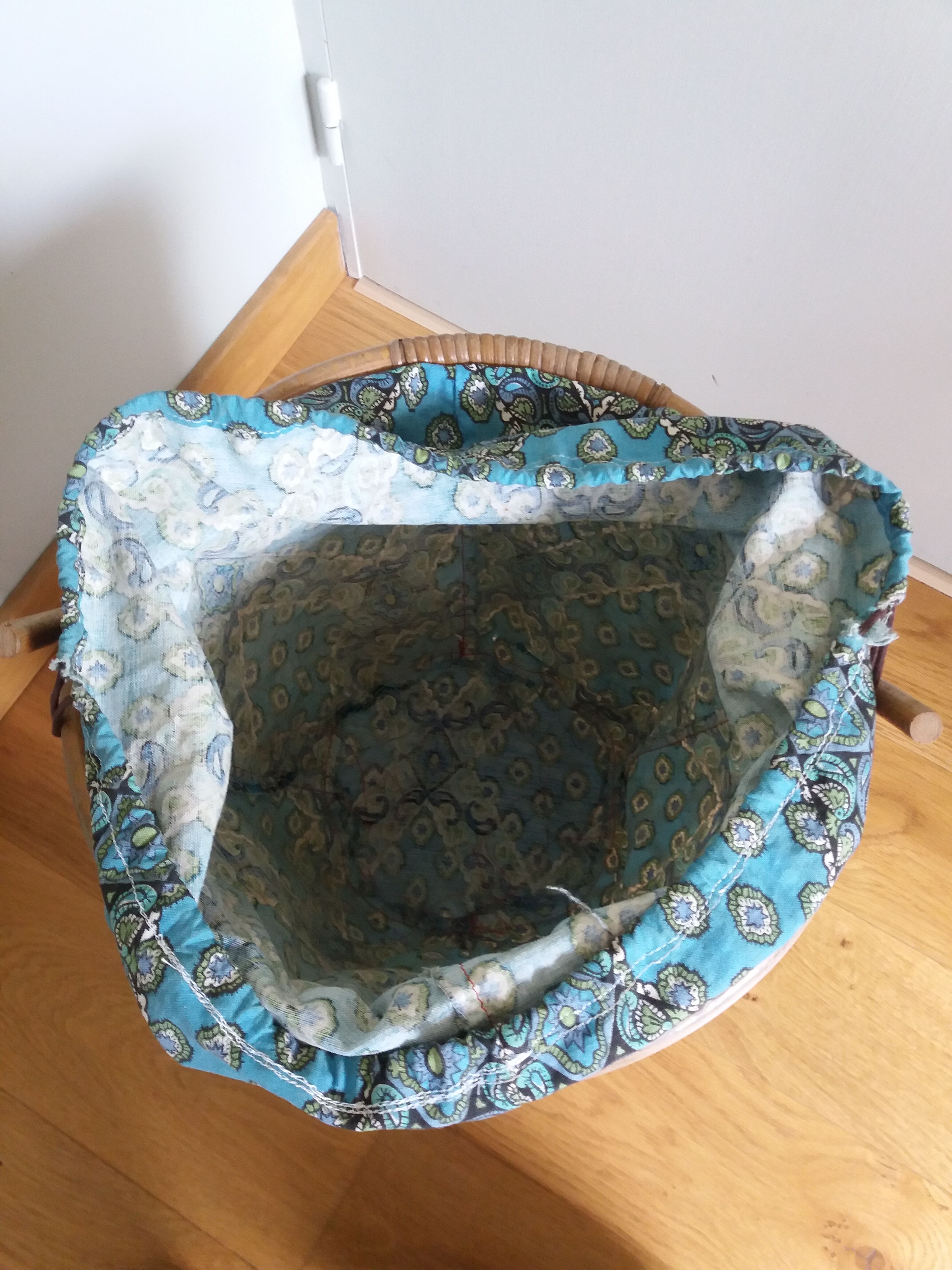 Wicker worker round basket with work, knitting