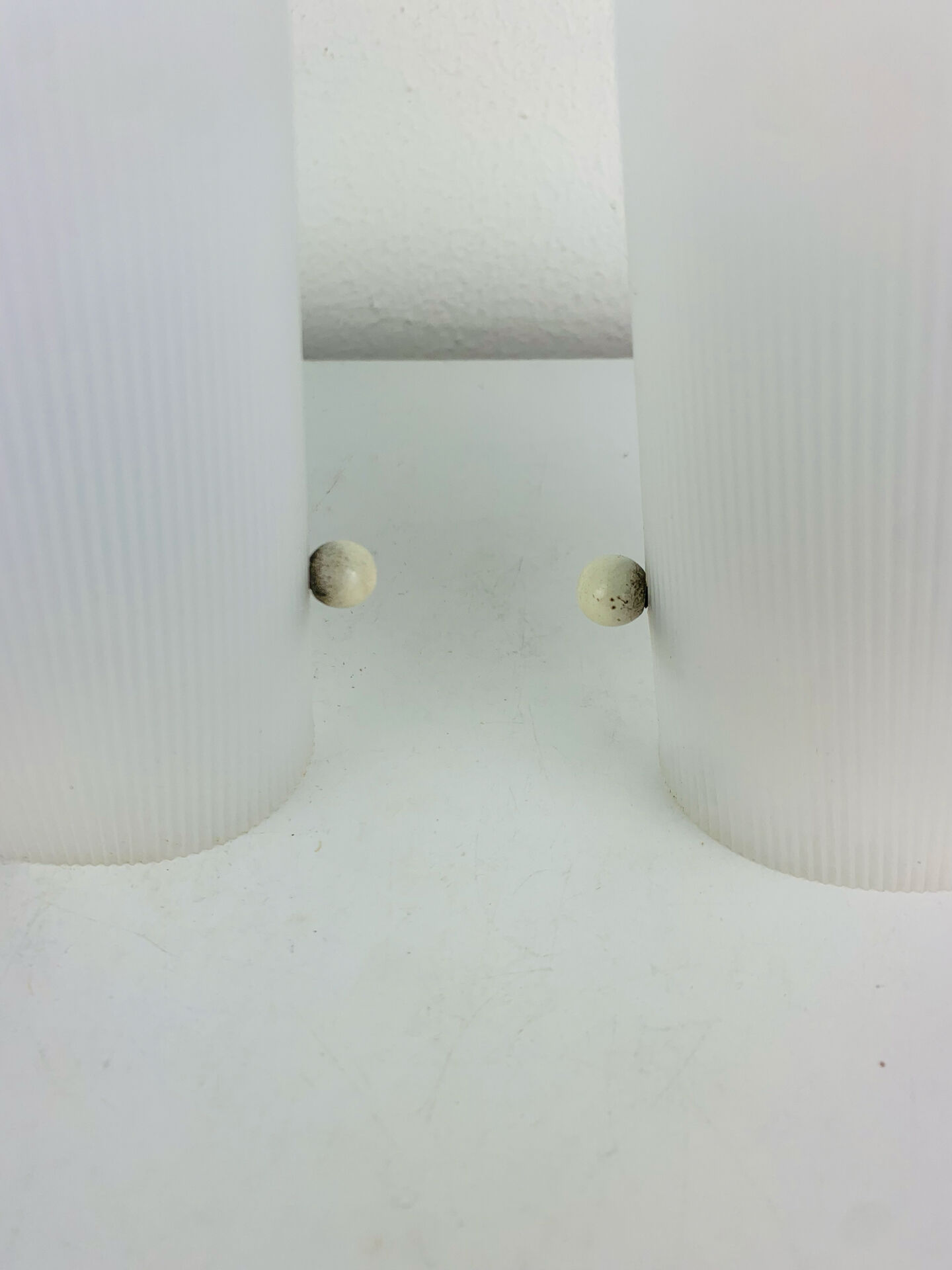 Pair of 1950s striped plastic wall lights.