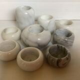 9 marble candle holders of different sizes