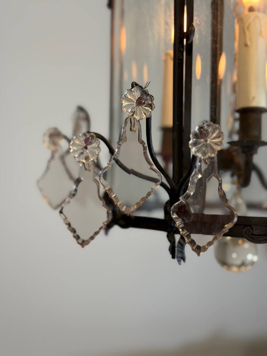 Louis XV style lantern in blackened brass adorned with cut crystal pendants, circa 1900.