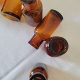 11 bottles of amber glass apothecary