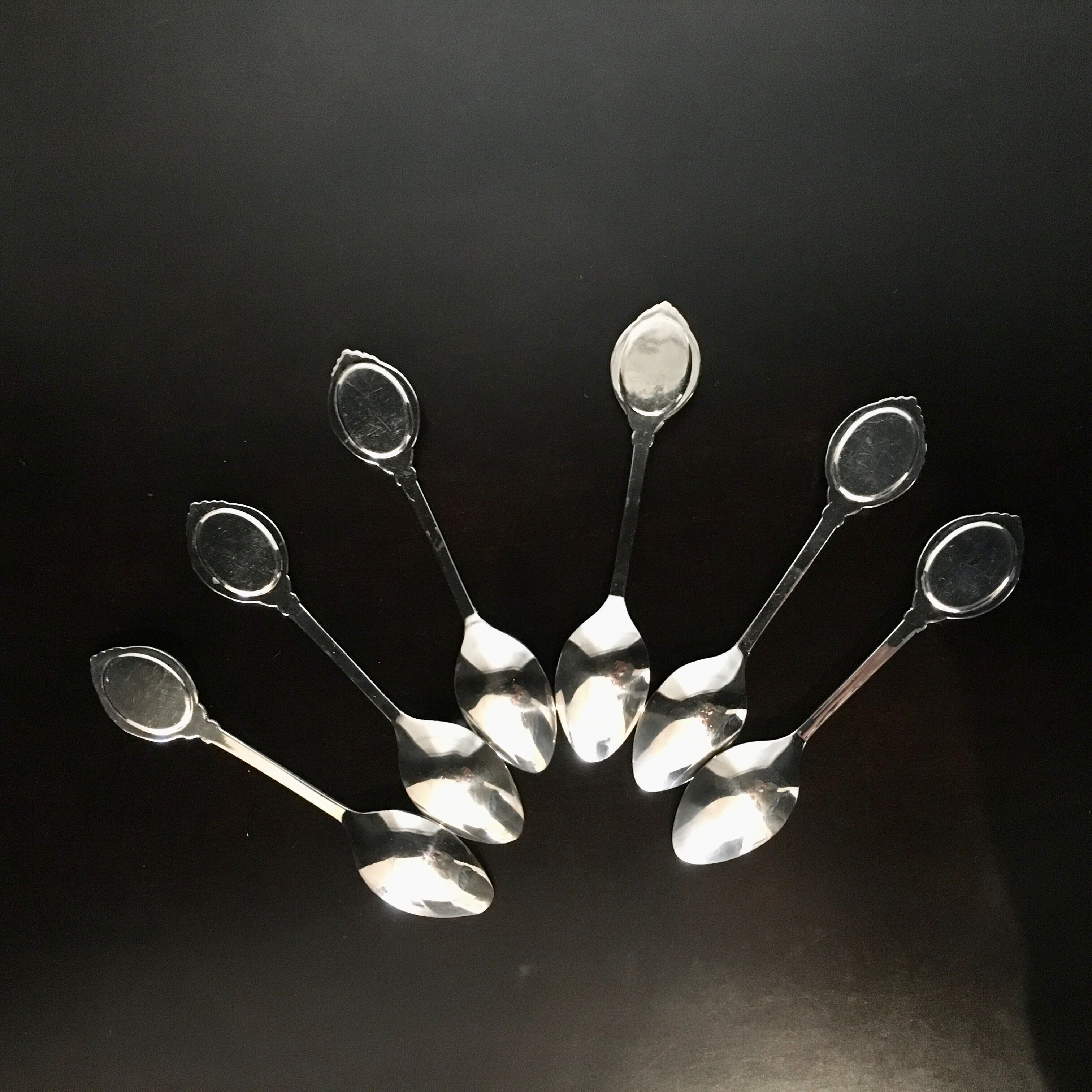 6 small spoons with porcelain medallion