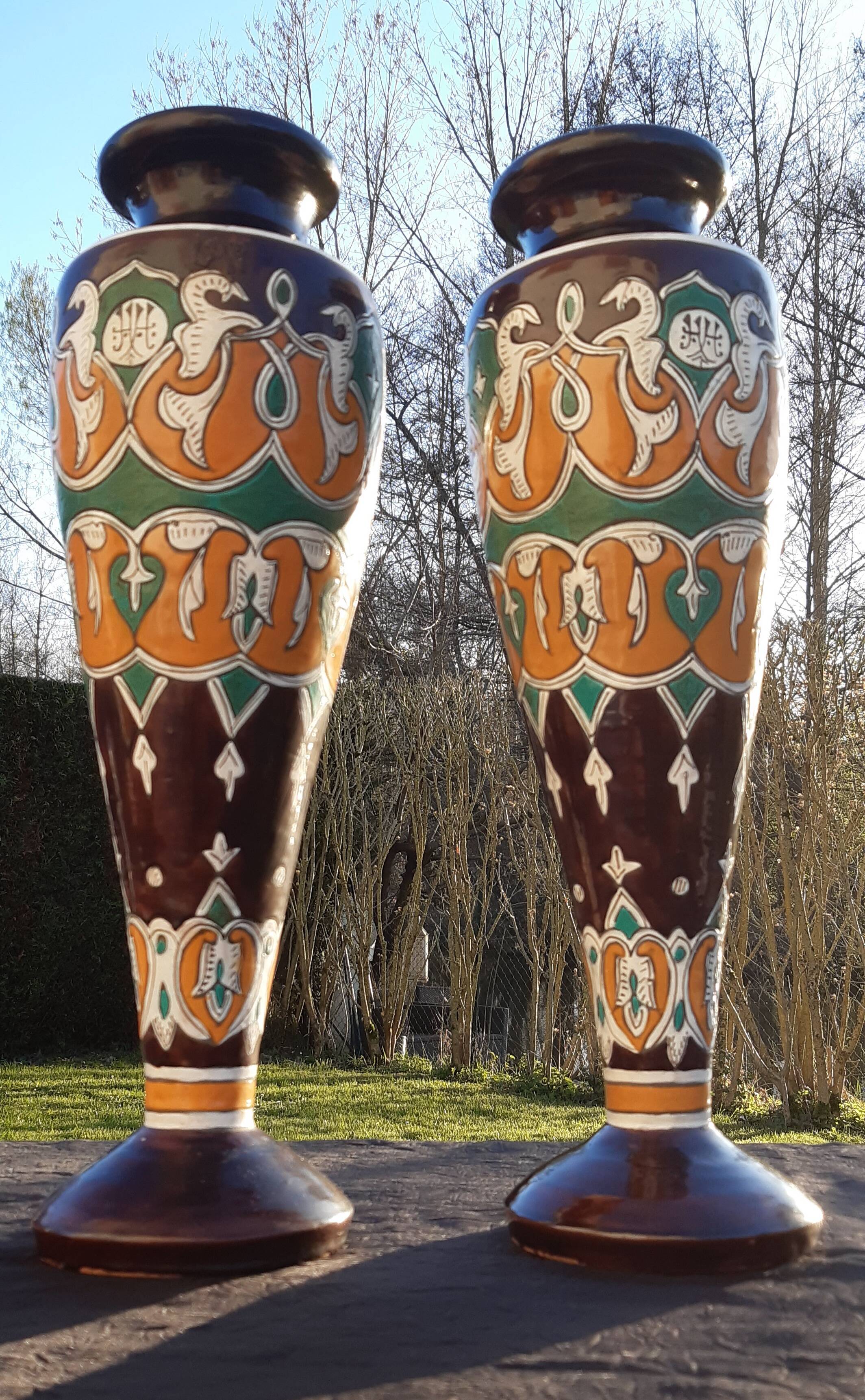 pair of old vases with art deco motifs