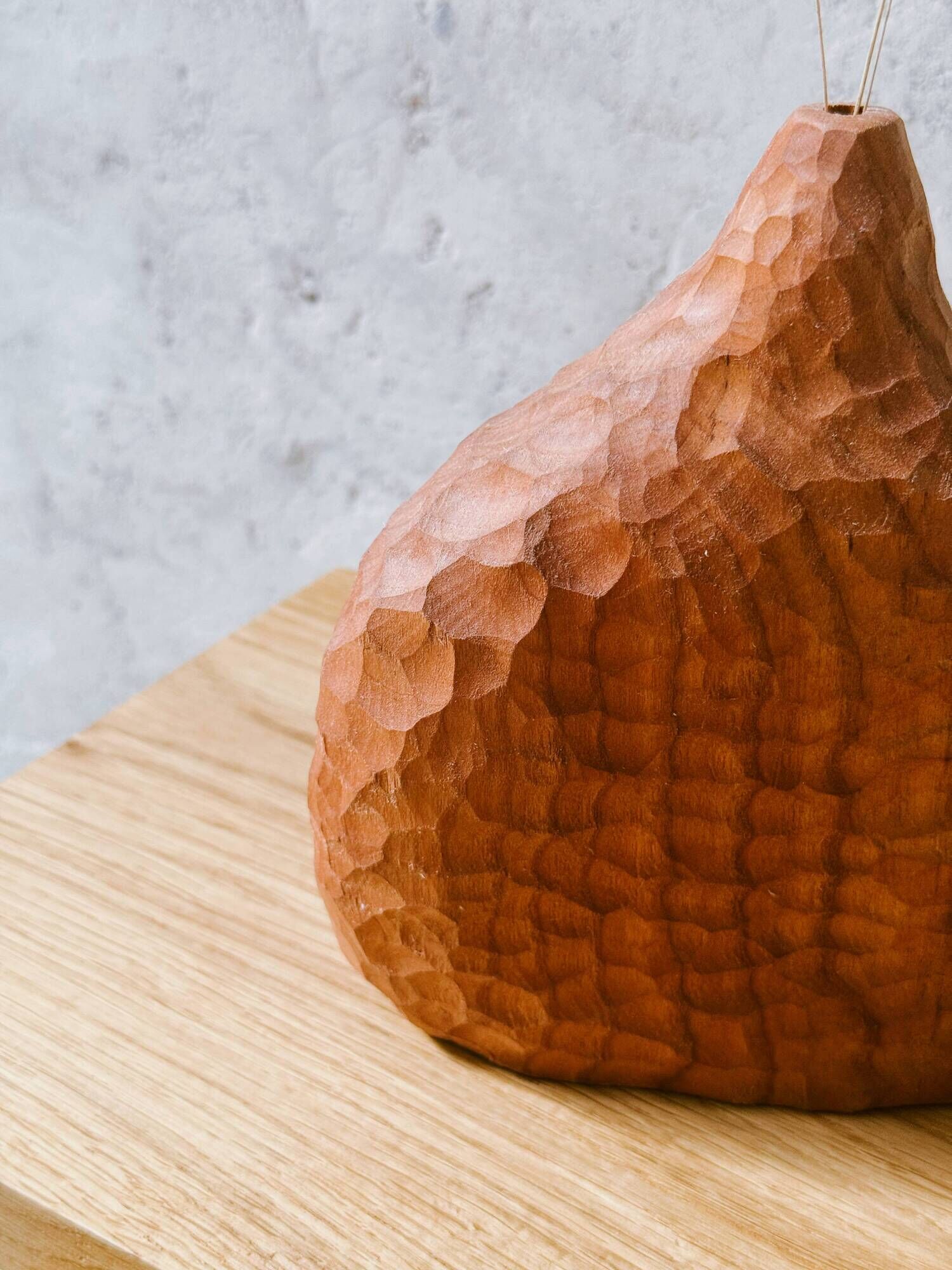 Hand-carved soliflore vase in solid cherry wood.