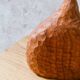 Hand-carved soliflore vase in solid cherry wood.