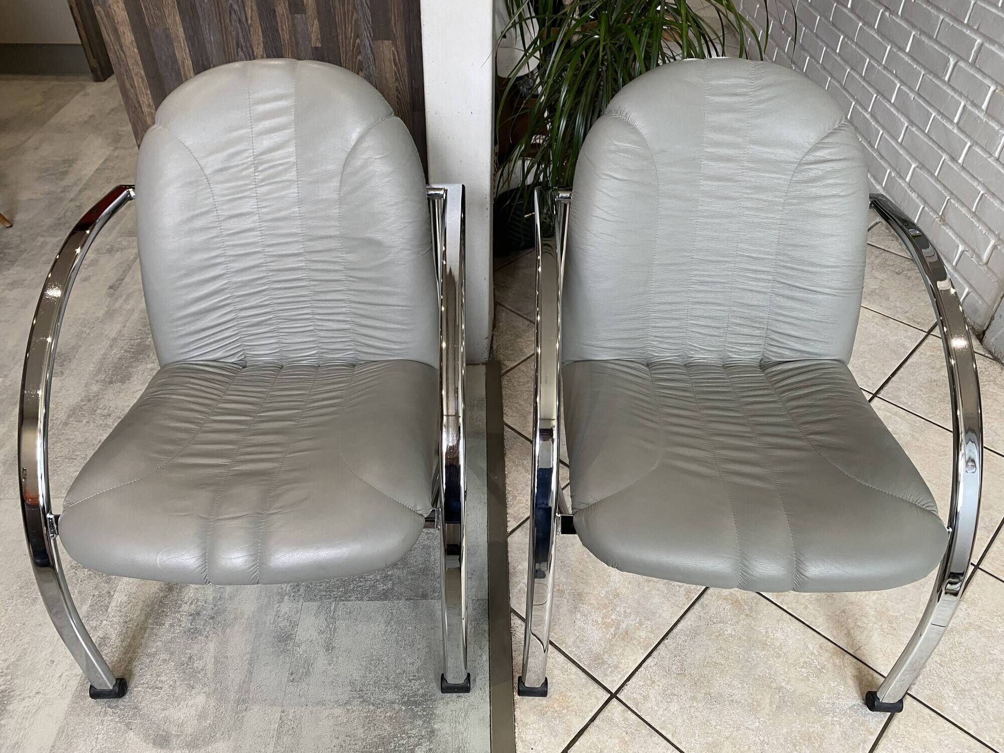 Pair of Souvignet armchairs, grey leather, chrome, 1980.