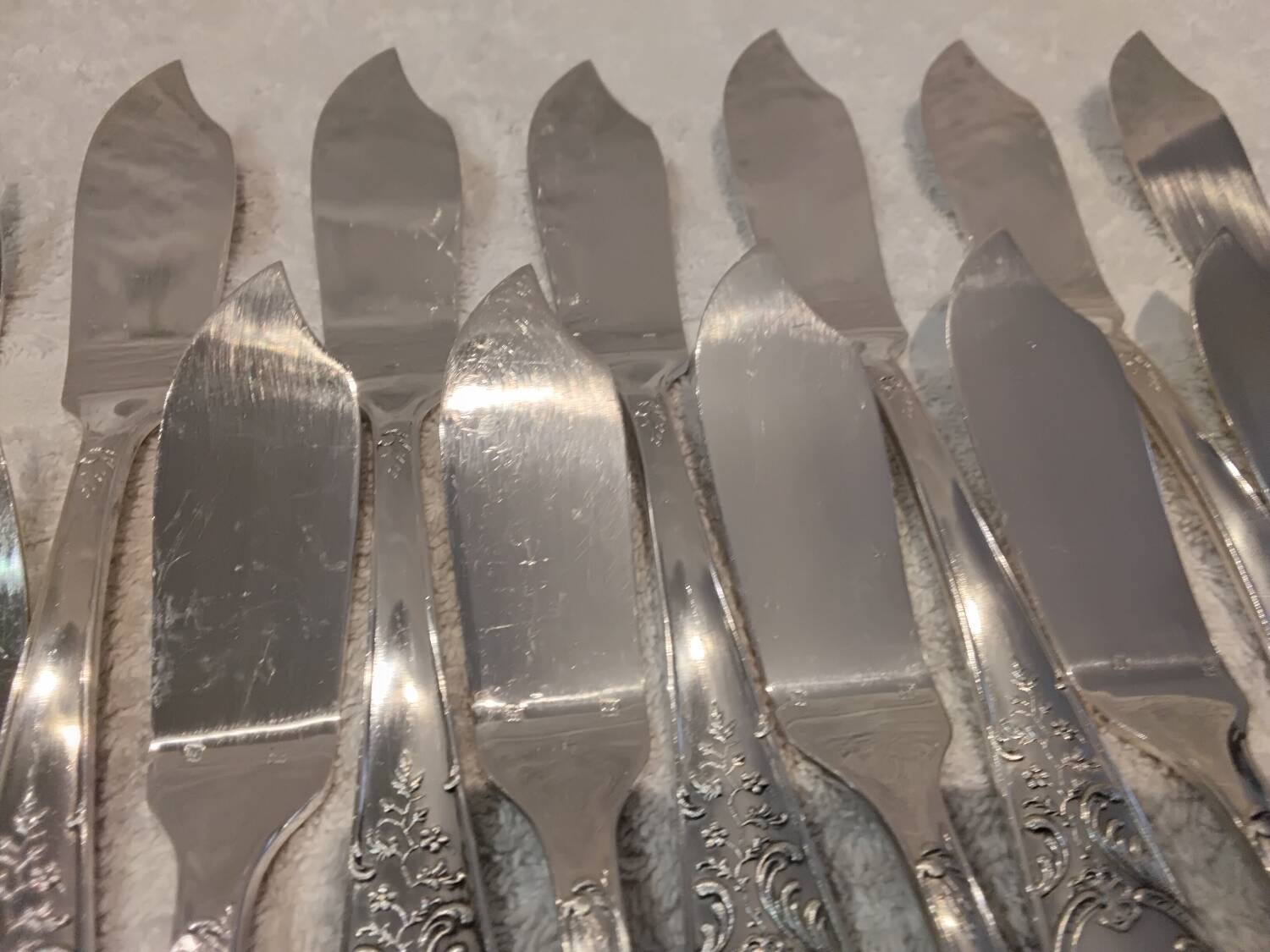 12 forks, 12 fish knives, silver-plated metal, rocaille pattern