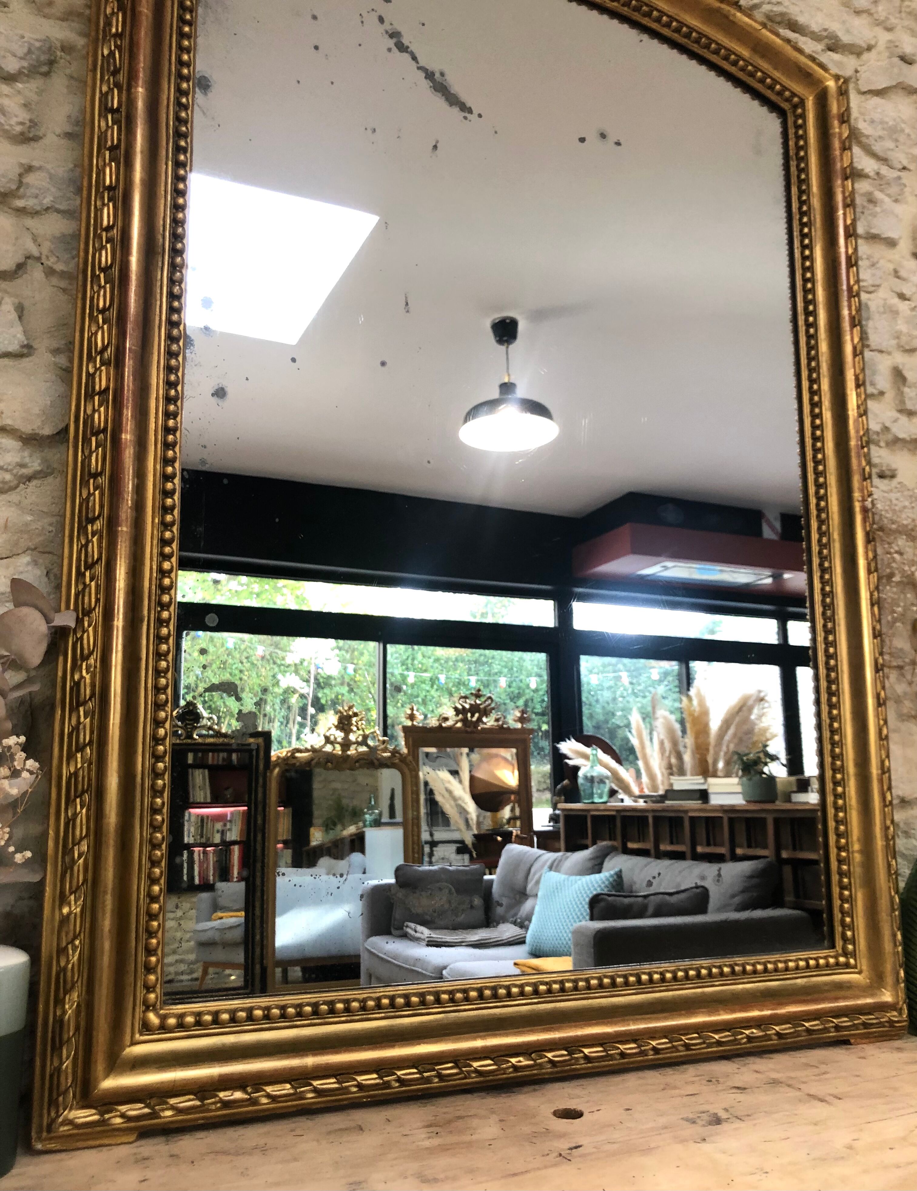 Old mirror 139cm/ 91cm Louis-Philippe with pediment period early 19th, presence of gold leaf.