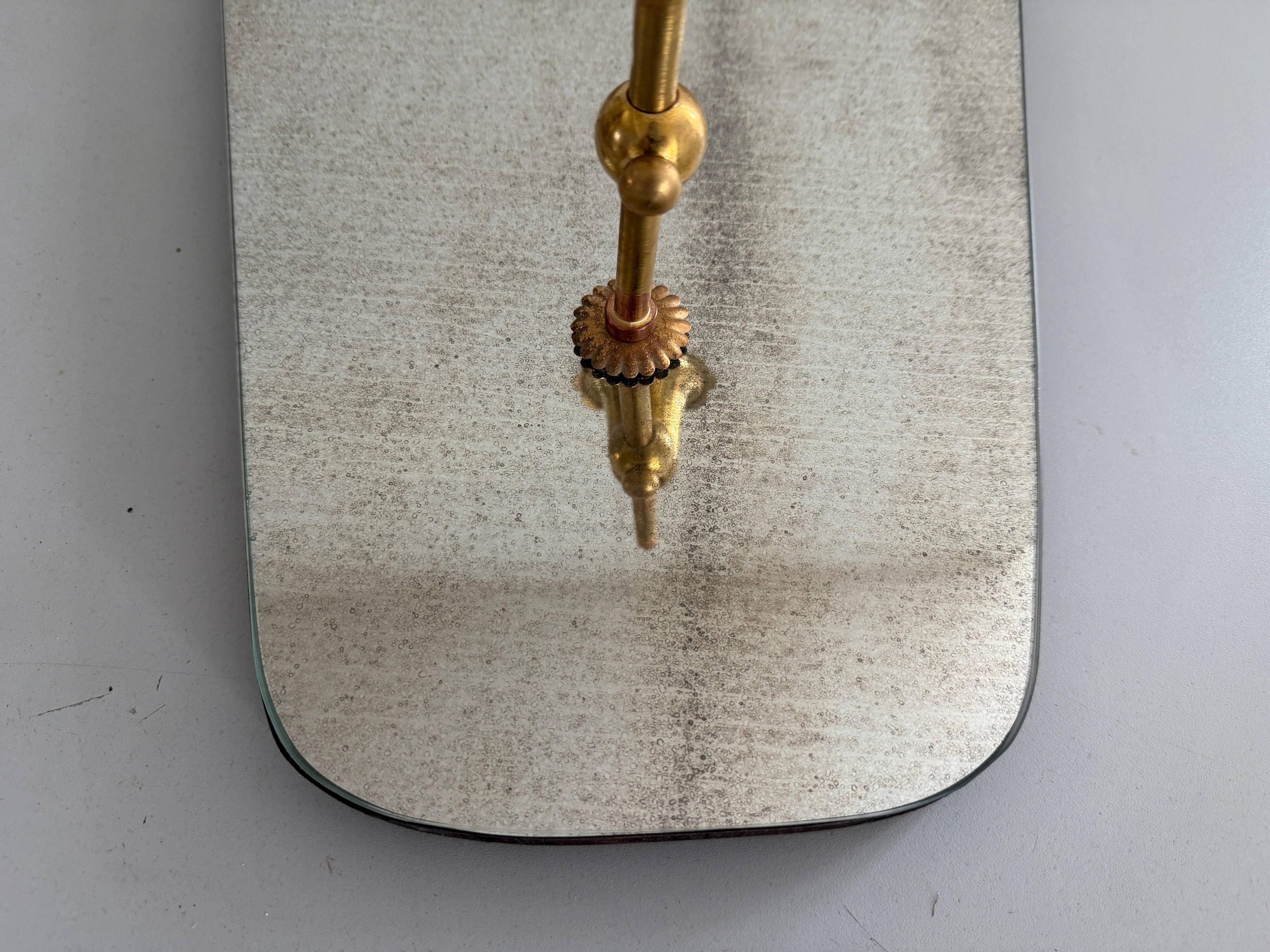 Pair of brass wall lights with mirrors, mid-20th century, Italy, 1960.