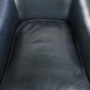Set of dark blue cow leather club armchairs with a unique design
