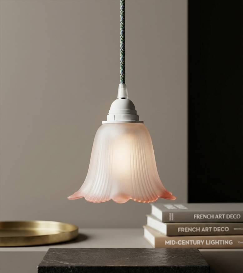 Opaque glass tulip with a pink rim and green cable.