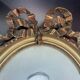 Oval medallion frame in wood and gilded stucco, Louis XVI style knot