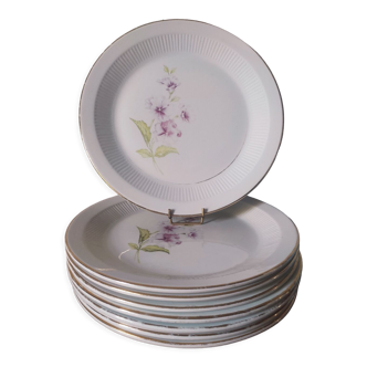 8 flat earthenware plates decorated with hollyhocks