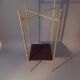 Pedestal table in patinated gilded brass faux foldable bamboo.