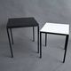 Pair of modernist nesting tables in black metal and white and black opaline 1960.
