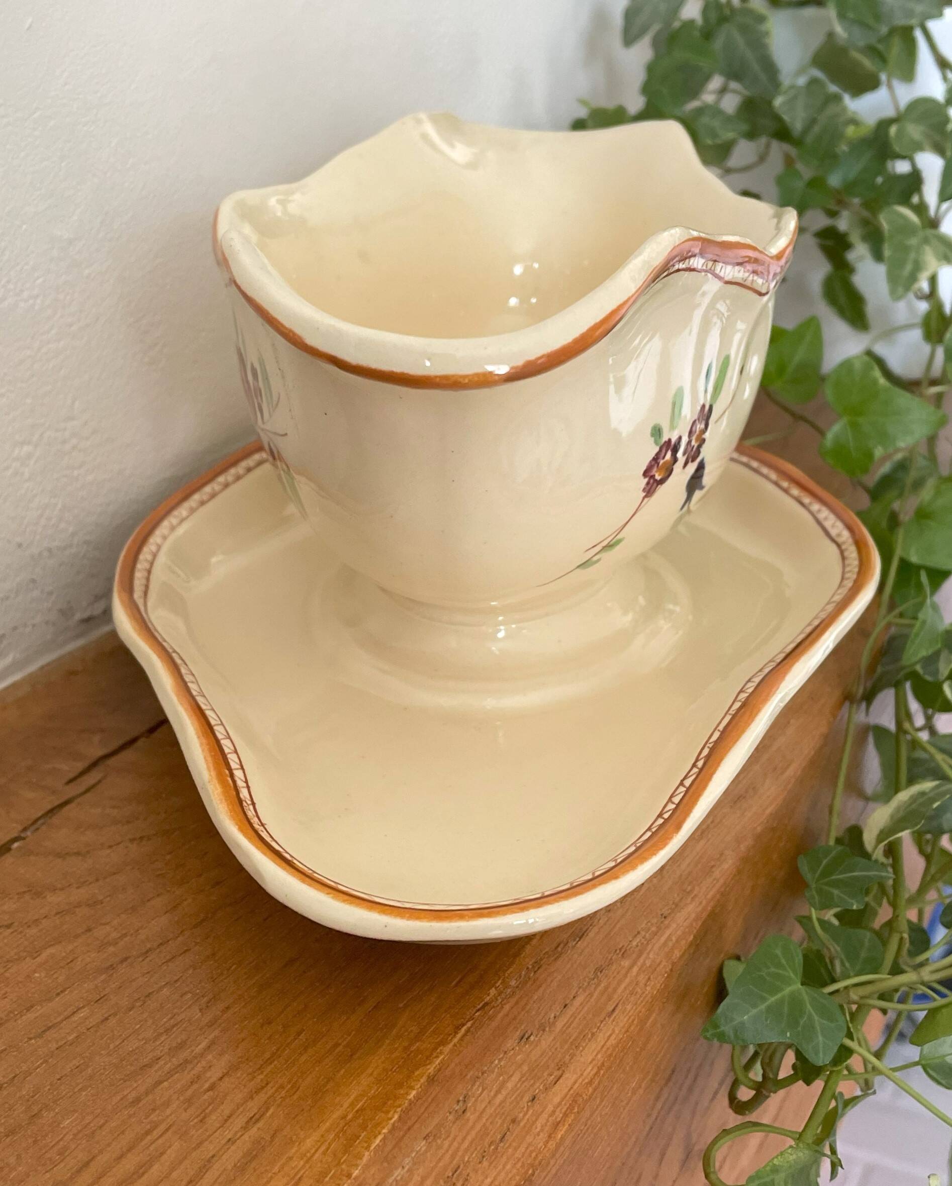 Large antique sauceboat in Longchamp earthenware.