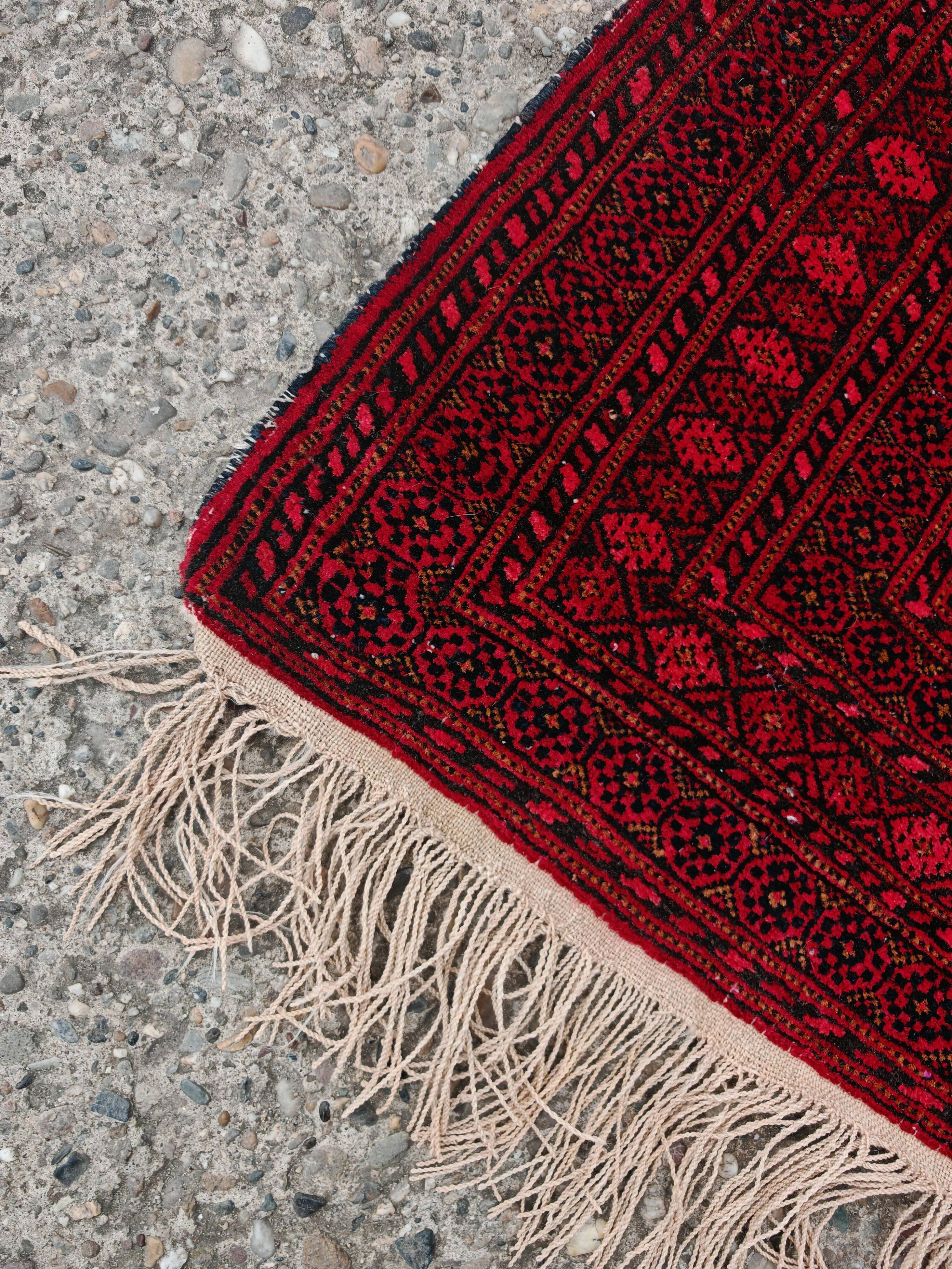 Vintage Baluch carpet handmade from natural wool, Afghanistan 1960.