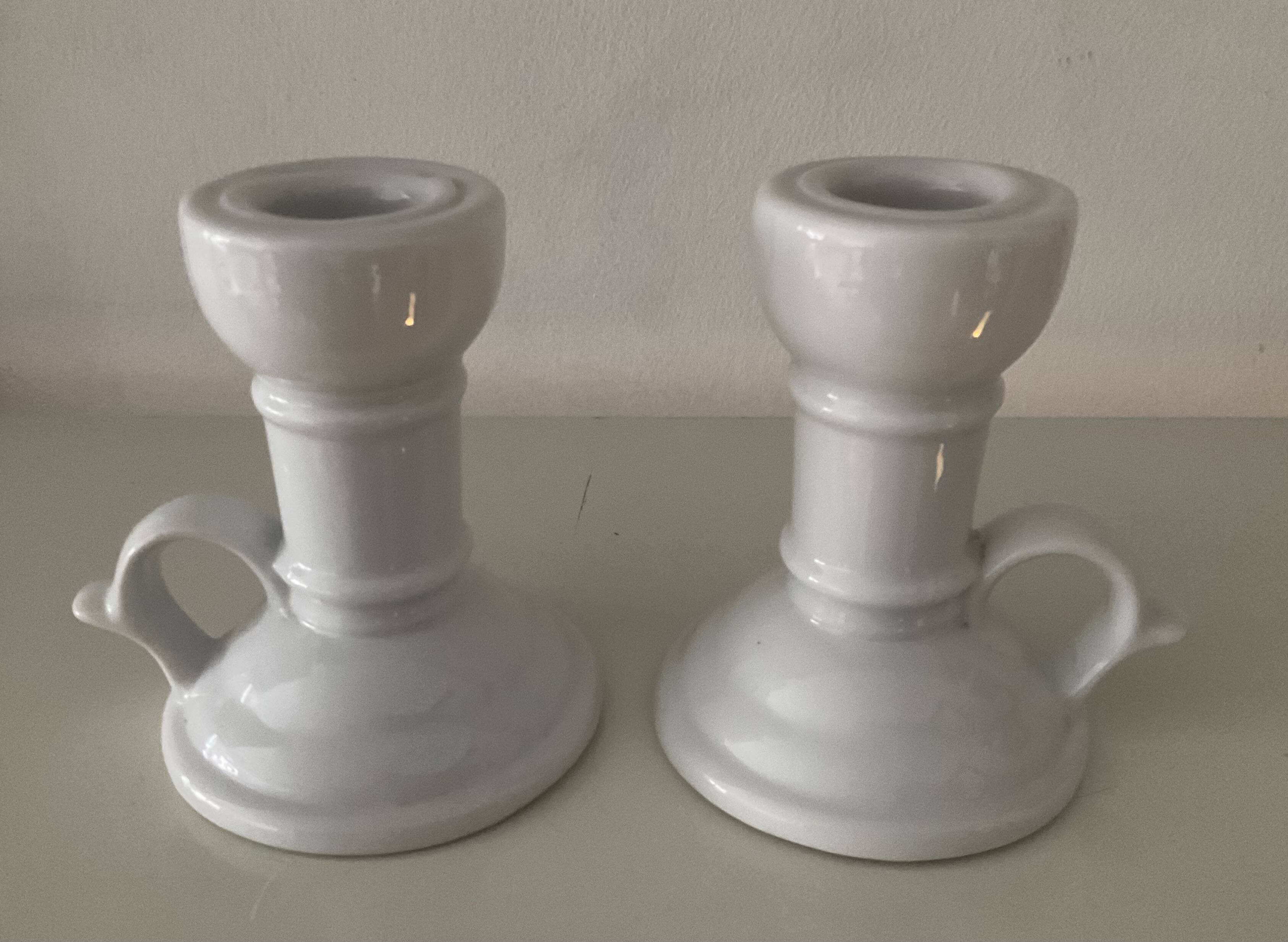 Pair of vintage cellar rat porcelain candlesticks