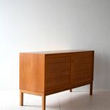 Scandinavian oak cabinet with woven rattan doors