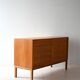 Scandinavian oak cabinet with woven rattan doors