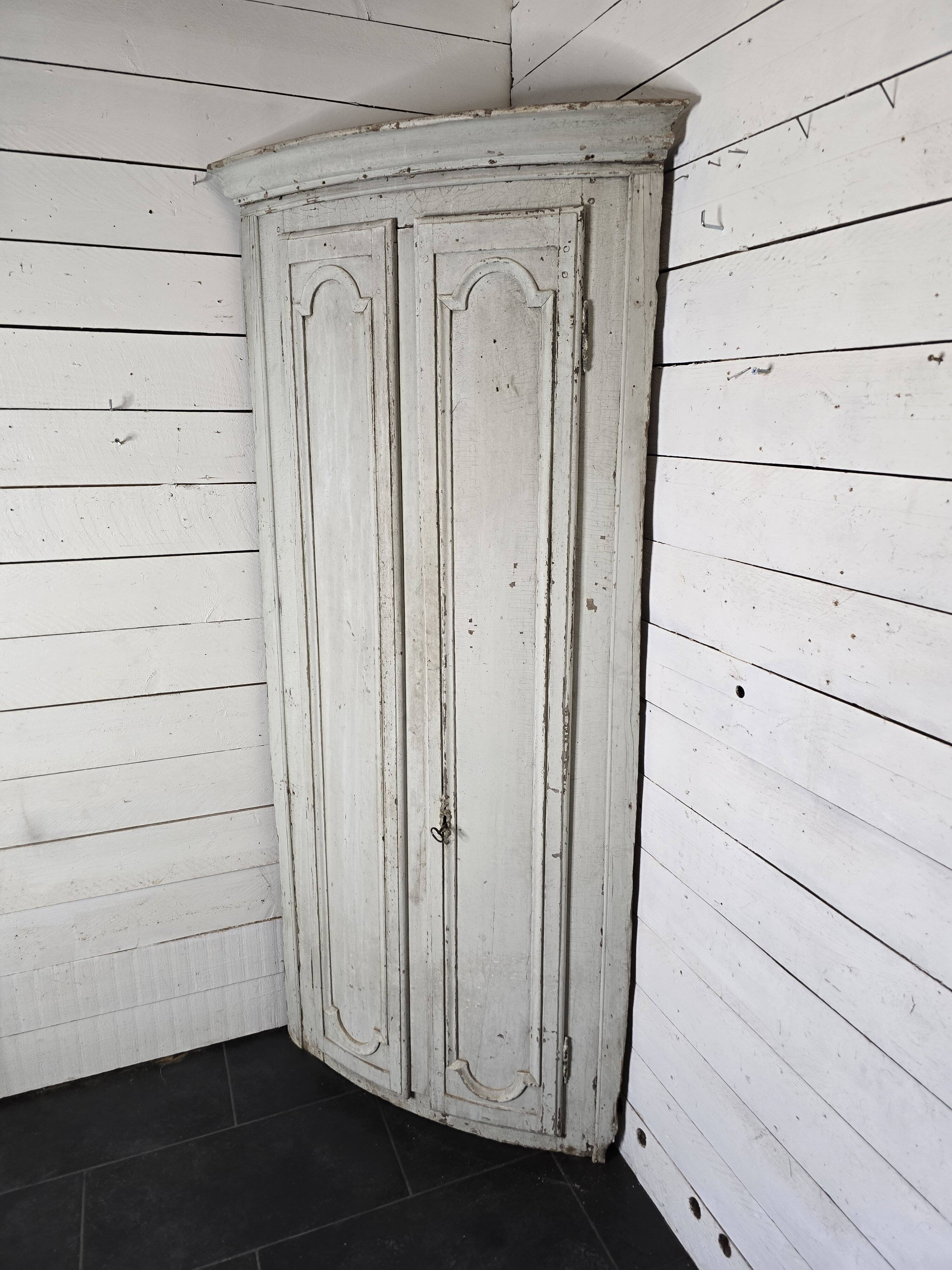 19th century curved corner cupboard in patinated oak