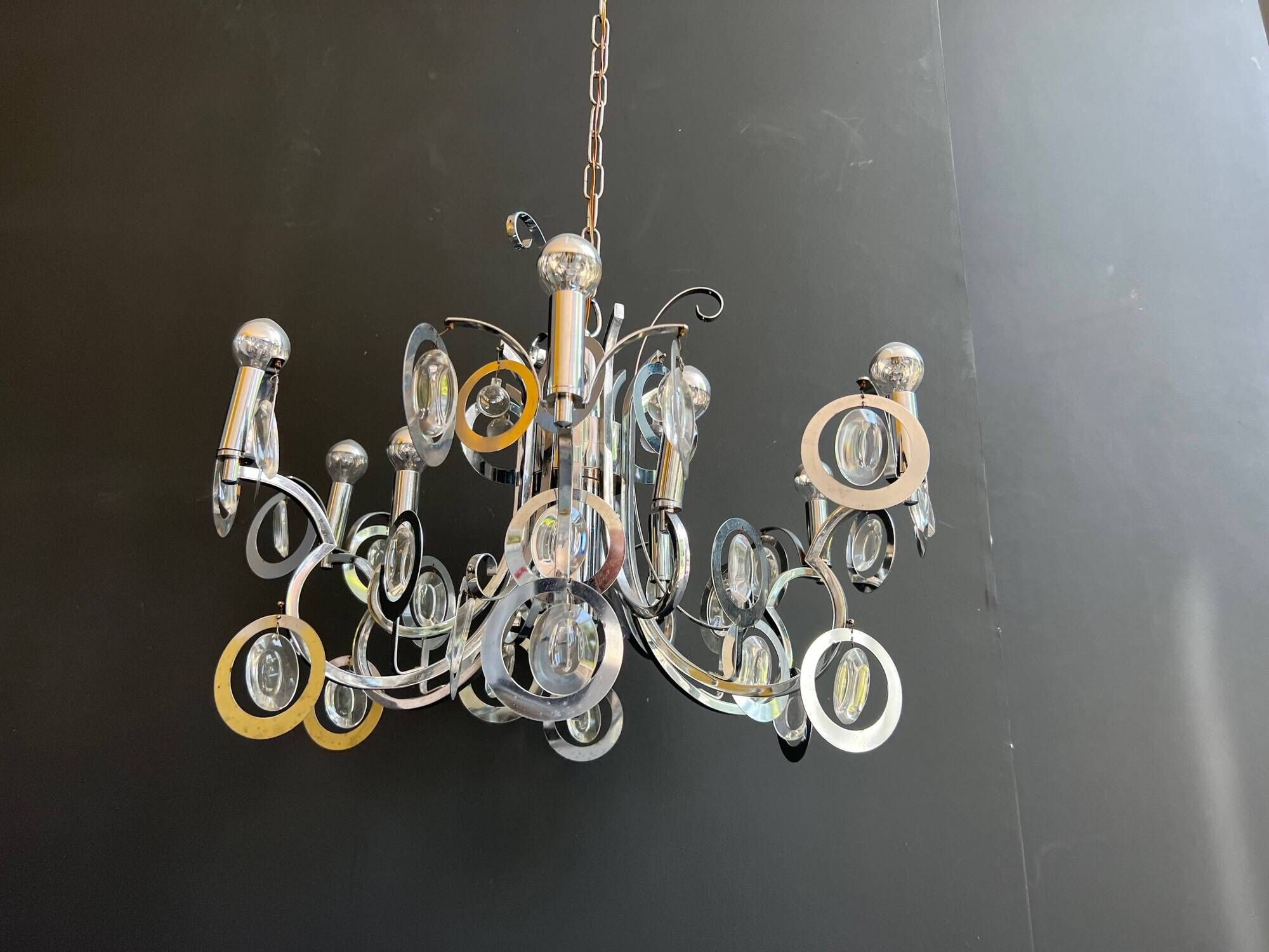 Chrome Metal Design with Swirls and Optical Glass Lenses. Tra
